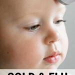 Young child having temperature taken