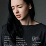 Young woman holding stomach with stomach pain