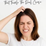 Woman scratching her head