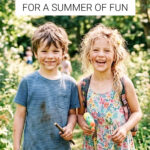 Grinning boy and girl playing outdoors