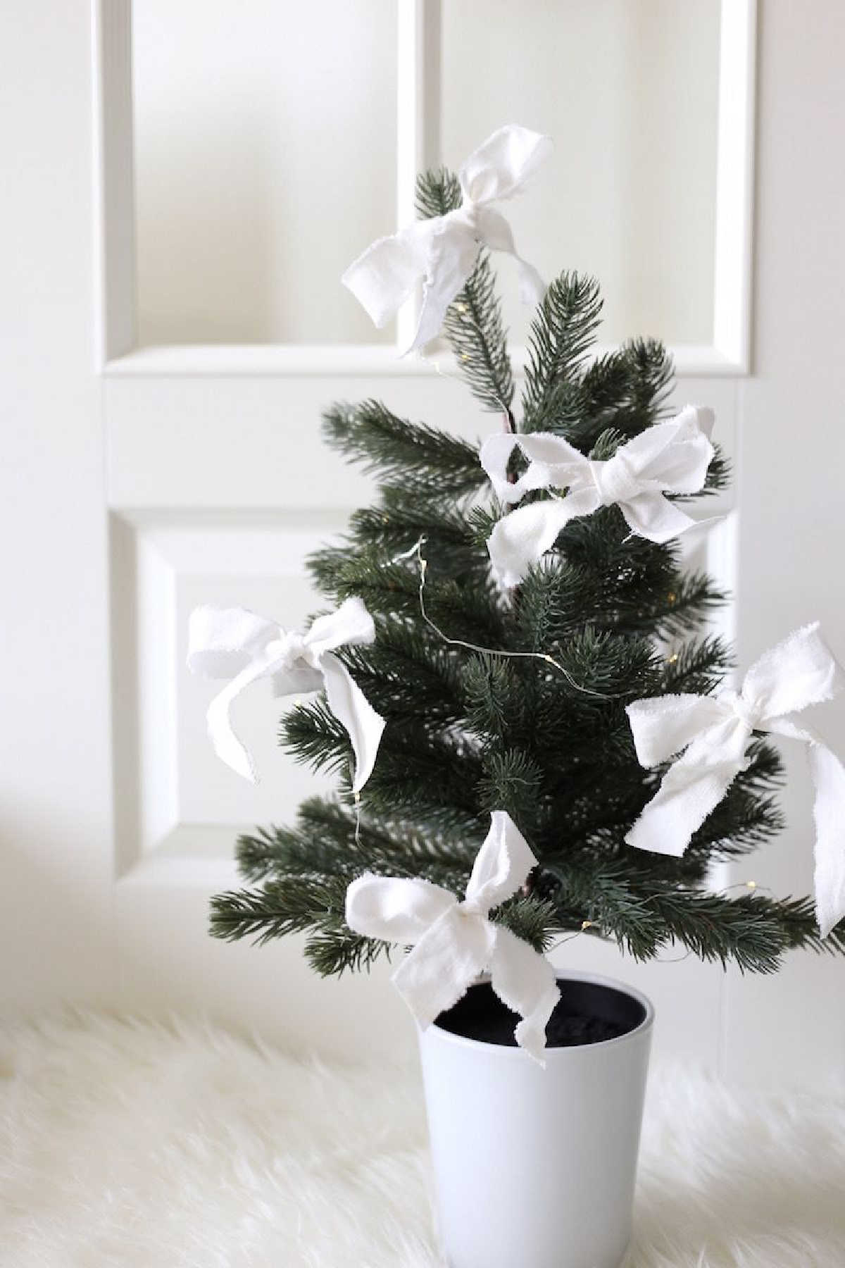 Mini Christmas Trees With White Ribbons