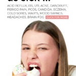 Unhappy young woman eating an iced doughnut