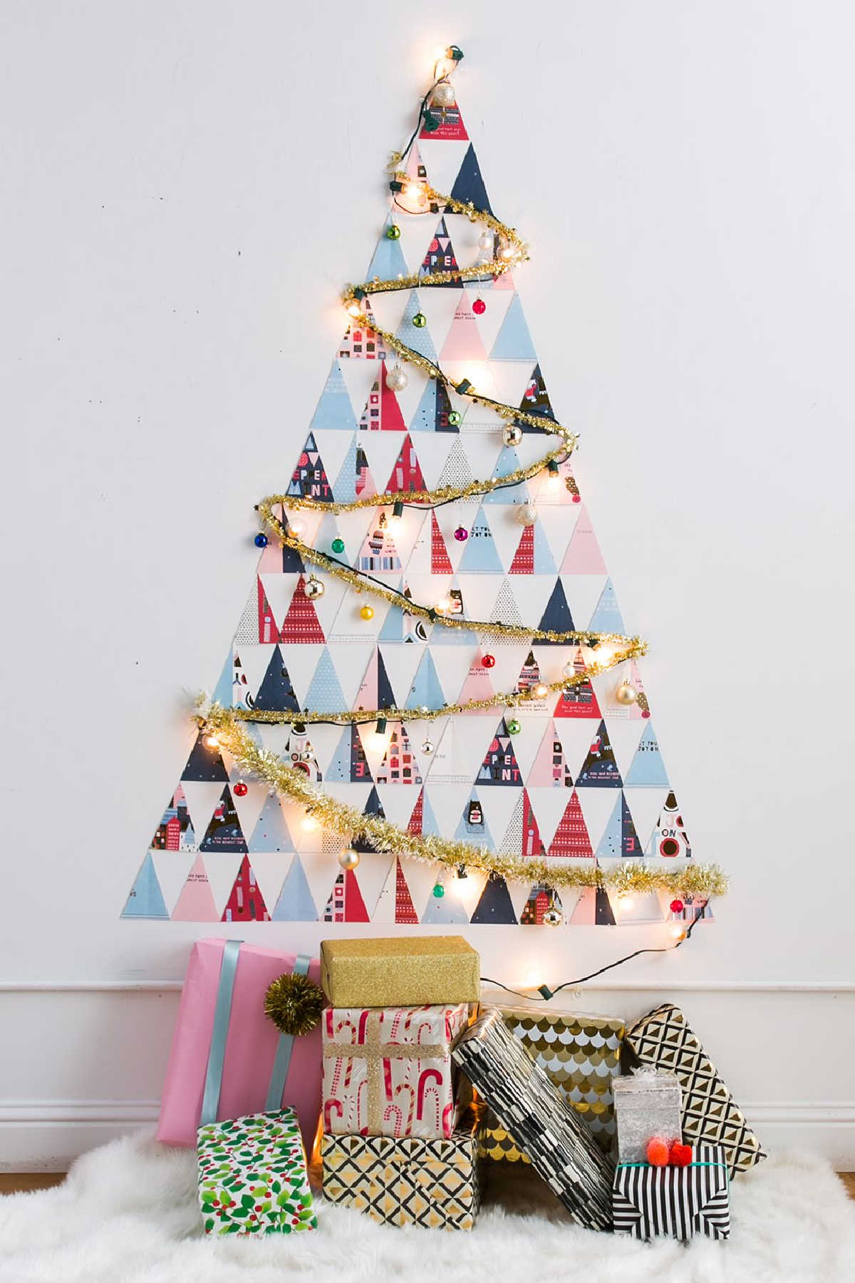 Wall Christmas tree made from card cut outs.