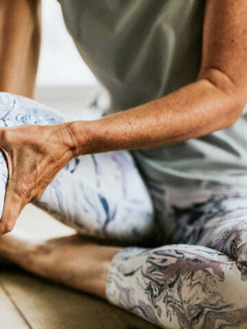 Woman holding her knee with joint pain