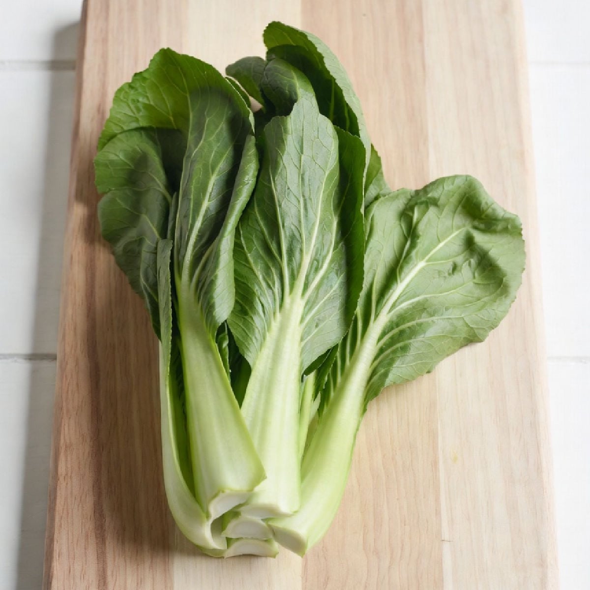 Pak-choi on a wooden chopping board