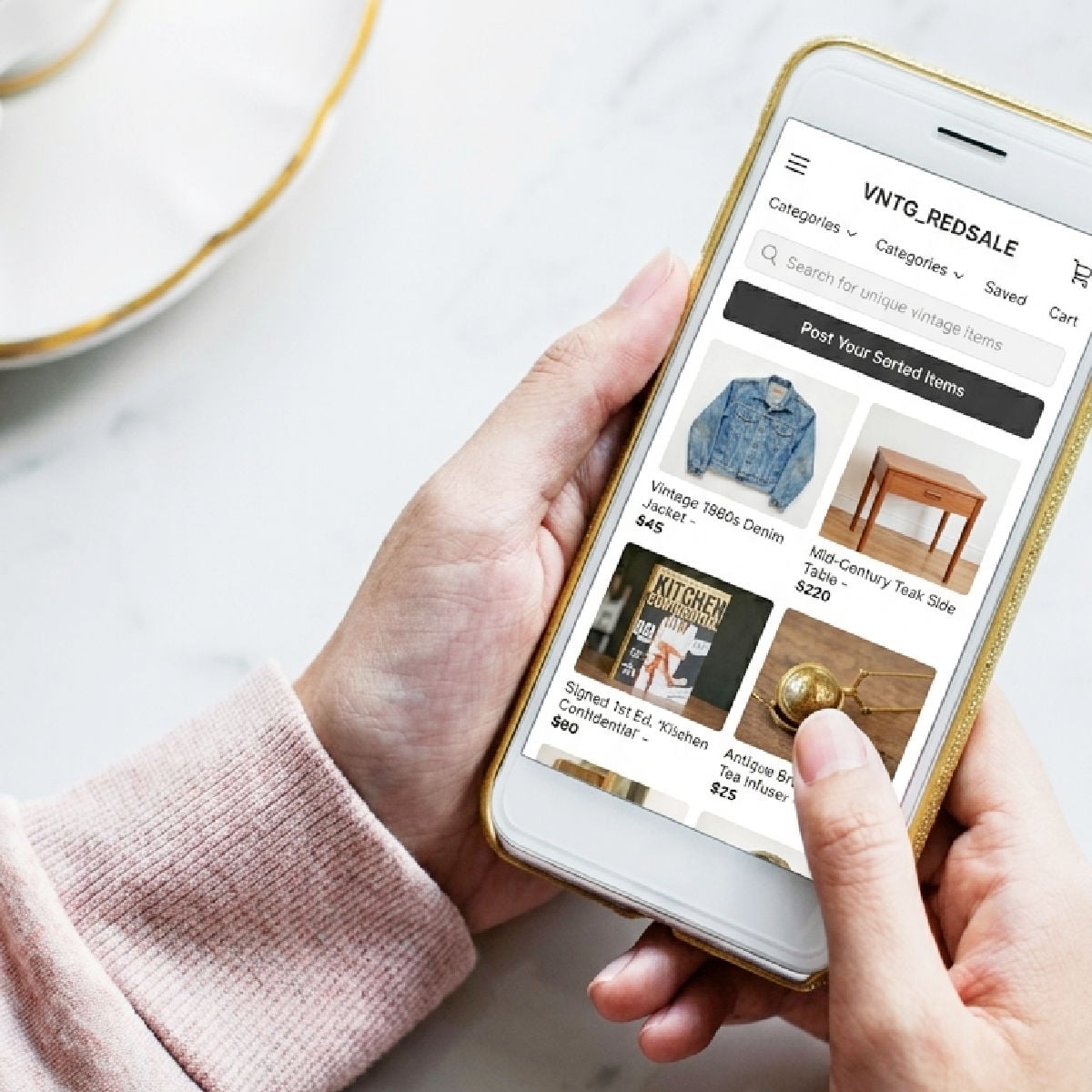 Woman looking a vintage selling website on mobile phone