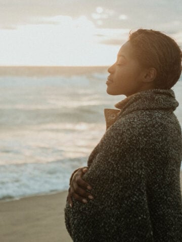 Woman calmly relaxing by the sea