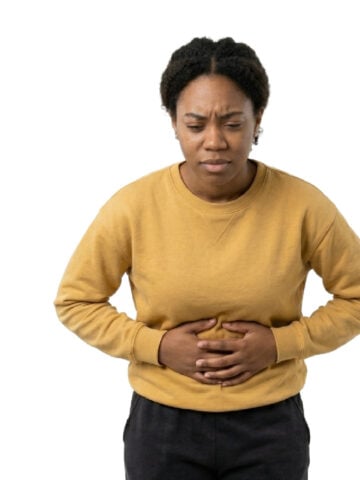 Woman holding her stomach in pain