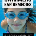 Girl wearing goggles swimming under water