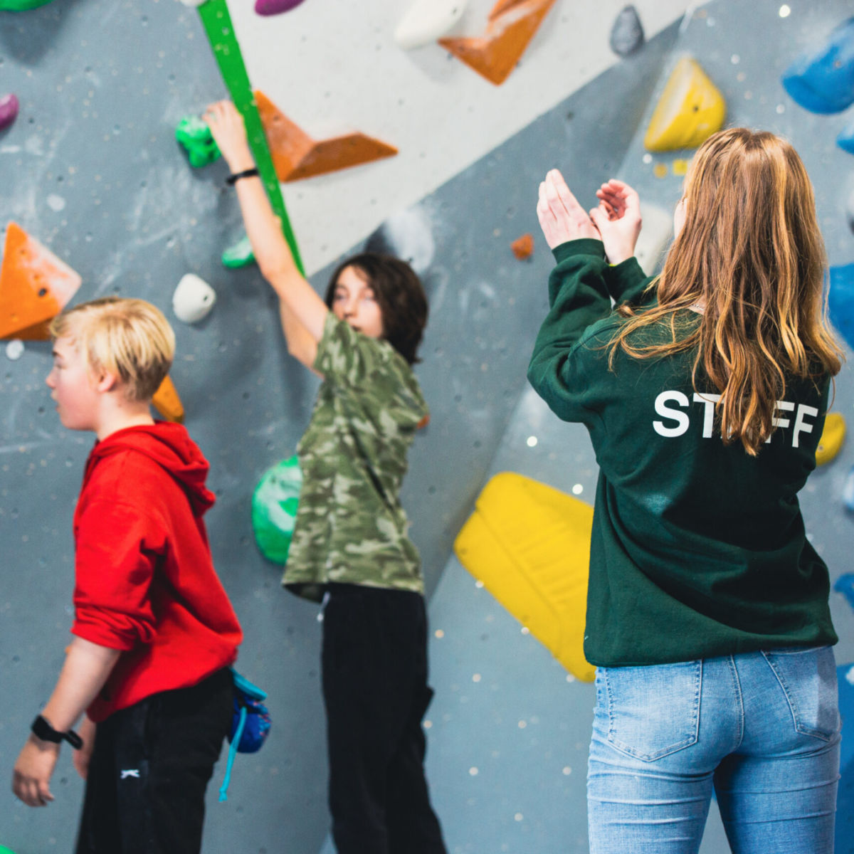 Kids climbing at a climbing centre
