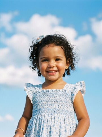 Cute smiling girl in a pretty dress