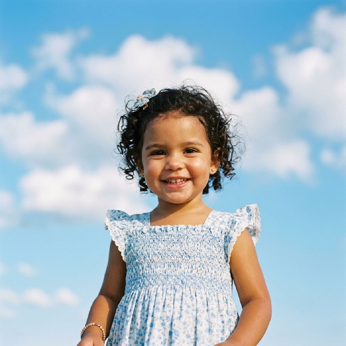 Cute smiling girl in a pretty dress