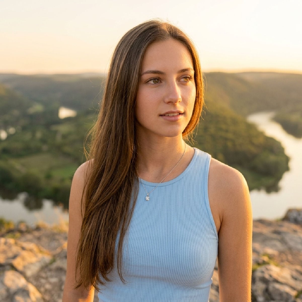 Young woman with face lit by the morning sun