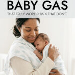Mother holding young baby against her shoulder and patting it on the back
