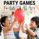 Young boy and girl playing with balloon at a party